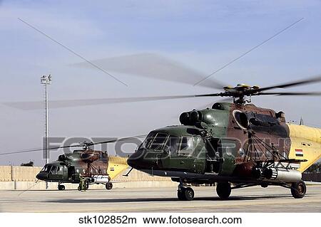 Two Iraqi Mi-17 Hip Helicopters conduct an aeromedical evacuation mission. View Large Photo Image Picture - Two Iraqi Mi-17 Hip Helicopters conduct an aeromedical evacuation mission.. Fotosearch