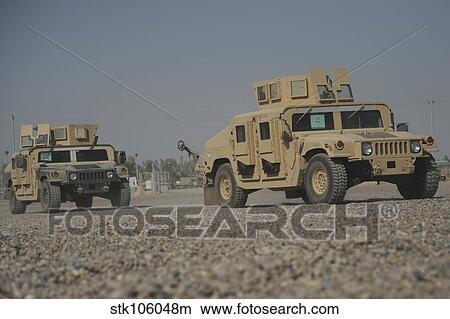 Two M1114 Humvee vehicles at Camp Taji, Iraq. View Large Photo Image Picture - Two M1114 Humvee vehicles at Camp Taji, Iraq.. Fotosearch