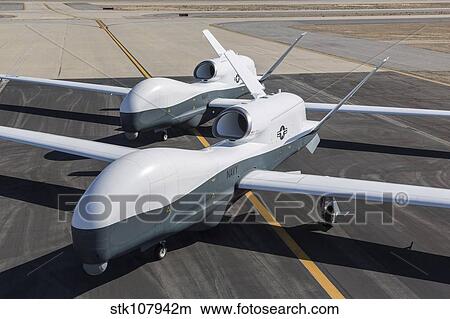 Picture - Two MQ-4C Triton unmanned aerial vehicles on the tarmac.. Fotosearch