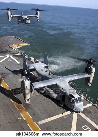 Two MV-22 Ospreys land on the flight deck of USS Nassau. View Large Photo Image Picture - Two MV-22 Ospreys land on the flight deck of USS Nassau.. Fotosearch