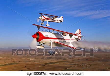Two Pitts Model 12 aircraft in flight. View Large Photo Image Picture - Two Pitts Model 12 aircraft in flight.. Fotosearch