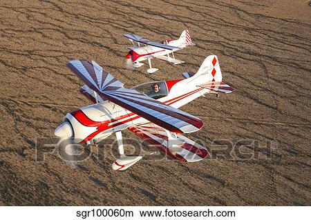 Two Pitts Model 12 aircraft in flight. View Large Photo Image Picture - Two Pitts Model 12 aircraft in flight.. Fotosearch