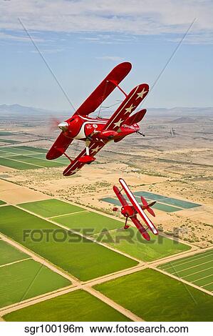 Two Pitts Special S-2A aerobatic biplanes in flight near Chandler, Arizona. View Large Photo Image Picture - Two Pitts Special S-2A aerobatic biplanes in flight near Chandler, Arizona.. Fotosearch