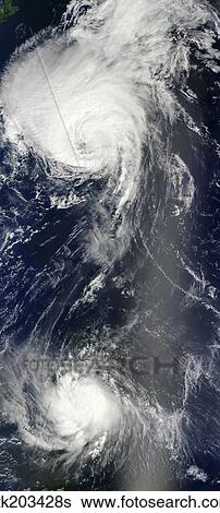 Two powerful storms span the Atlantic Ocean. View Large Photo Image Stock Photograph - Two powerful storms span the Atlantic Ocean.. Fotosearch