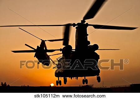Two Royal Air Force CH-47 Chinooks take off from headquarters in Afghanistan. View Large Photo Image Picture - Two Royal Air Force CH-47 Chinooks take off from headquarters in Afghanistan.. Fotosearch