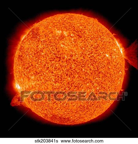 Stock Photograph - Two solar prominences erupt from the Sun.. Fotosearch