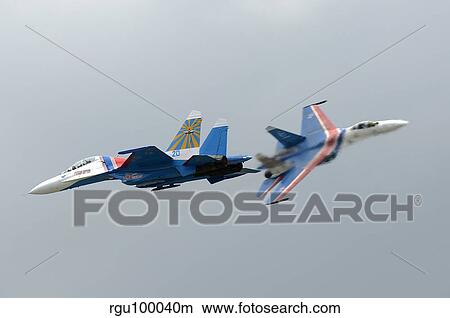 Two Sukhoi Su-27 Flanker of the Russian Knights aerobatic team. View Large Photo Image Picture - Two Sukhoi Su-27 Flanker of the Russian Knights aerobatic team.. Fotosearch
