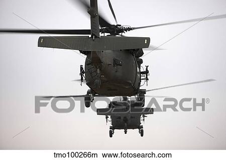 Two UH-60 Black Hawks underway on a mission over northern Iraq. View Large Photo Image Picture - Two UH-60 Black Hawks underway on a mission over northern Iraq.. Fotosearch