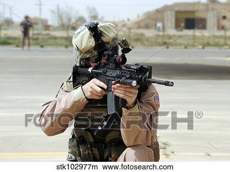 U. S. Air Force Airman conducts security at an airbase in Iraq. View Large Photo Image Picture - U. S. Air Force Airman conducts security at an airbase in Iraq.. Fotosearch