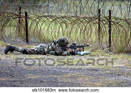 U. S. Air Force Airman guards a checkpoint during defensive operations. View Large Photo Image Picture - U. S. Air Force Airman guards a checkpoint during defensive operations.. Fotosearch