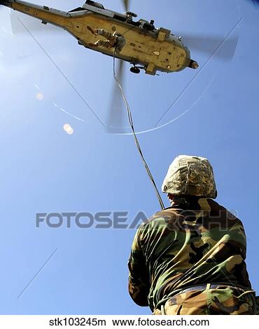 U. S. Air Force airmen conducting rappelling and fast-roping techniques at Andersen Air Force Base, Guam. View Large Photo Image Picture - U. S. Air Force airmen conducting rappelling and fast-roping techniques at Andersen Air Force Base, Guam.. Fotosearch