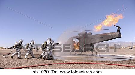 U. S. Air Force Airmen extinguish a simulated aircraft fire. View Large Photo Image Picture - U. S. Air Force Airmen extinguish a simulated aircraft fire.. Fotosearch