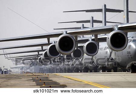 U. S. Air Force C-17 Globemaster III's lined up on the runway awaiting takeoff. View Large Photo Image Picture - U. S. Air Force C-17 Globemaster III's lined up on the runway awaiting takeoff.. Fotosearch