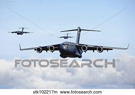 U. S. Air Force C-17 Globemaster's in flight. View Large Photo Image Picture - U. S. Air Force C-17 Globemaster's in flight.. Fotosearch