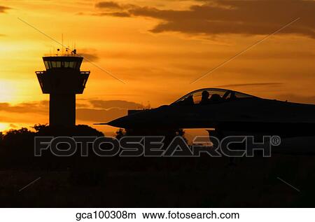 U. S. Air Force F-16 Fighting Falcon at sunset. View Large Photo Image Picture - U. S. Air Force F-16 Fighting Falcon at sunset.. Fotosearch