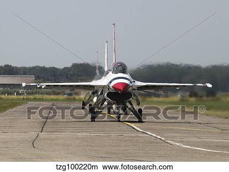 Picture - U. S. Air Force F-16 Thunderbird jets taxiing on the flight line.. Fotosearch