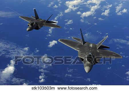 U. S. Air Force F-22 Raptors in flight near Guam. View Large Photo Image Picture - U. S. Air Force F-22 Raptors in flight near Guam.. Fotosearch