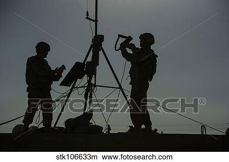 Picture - U. S. Air Force members conduct an inspection of a weather sensor.. Fotosearch