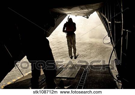 U. S. Air Force pararescuemen jump from a CH-53 Sea Stallion. View Large Photo Image Picture - U. S. Air Force pararescuemen jump from a CH-53 Sea Stallion.. Fotosearch