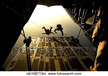U. S. Air Force pararescuemen jump from an HC-130 aircraft off the coast of Djibouti. View Large Photo Image Picture - U. S. Air Force pararescuemen jump from an HC-130 aircraft off the coast of Djibouti.. Fotosearch