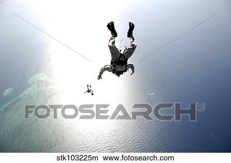 U. S. Air Force pararescuemen conducting a pararescue training jump from an HC-130 Hercules. View Large Photo Image Picture - U. S. Air Force pararescuemen conducting a pararescue training jump from an HC-130 Hercules.. Fotosearch