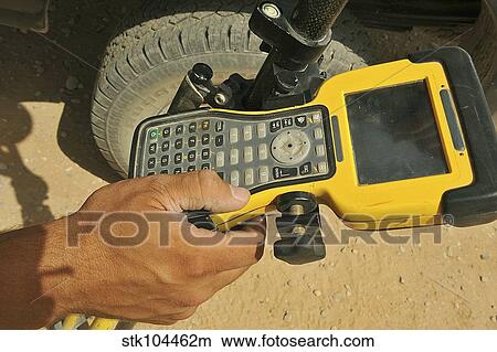 U. S. Air Force technician using a global positioning system device. View Large Photo Image Picture - U. S. Air Force technician using a global positioning system device.. Fotosearch