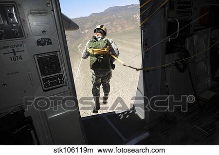 Picture - U. S. Airman jumps from a C-17 Globemaster III over Nevada.. Fotosearch