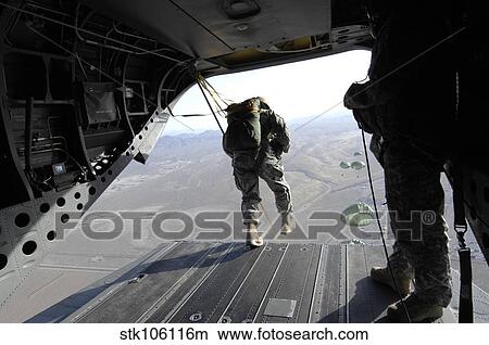 U. S. Airmen jump from a CH-47 Chinook over Nevada. View Large Photo Image Picture - U. S. Airmen jump from a CH-47 Chinook over Nevada.. Fotosearch
