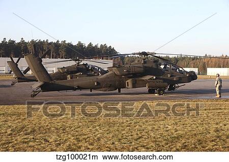 U. S. Army AH-64D Apache helicopters prepare for takeoff. View Large Photo Image Picture - U. S. Army AH-64D Apache helicopters prepare for takeoff.. Fotosearch