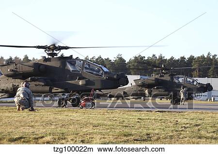 Picture - U. S. Army AH-64D Apache helicopters prepare for takeoff.. Fotosearch