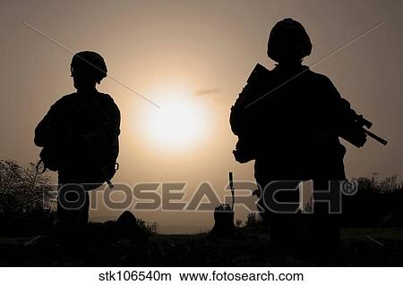 U. S. Army combat infantrymen provide security during a patrol. View Large Photo Image Picture - U. S. Army combat infantrymen provide security during a patrol.. Fotosearch