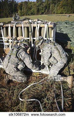 U. S. Army Europe Soldiers perform heavy-load drop recovery operations. View Large Photo Image Picture - U. S. Army Europe Soldiers perform heavy-load drop recovery operations.. Fotosearch