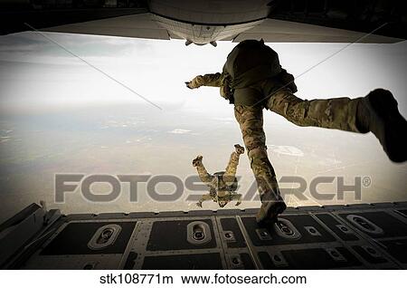 U. S. Army Green Berets jump out of a C-130H3 Hercules over Florida. View Large Photo Image Picture - U. S. Army Green Berets jump out of a C-130H3 Hercules over Florida.. Fotosearch