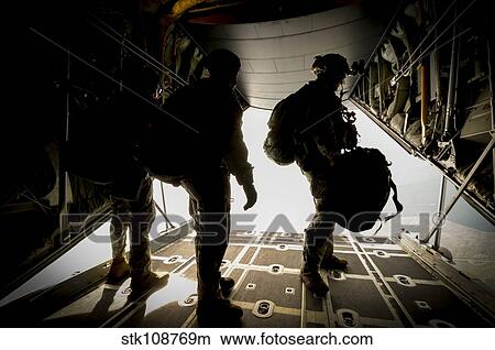 U. S. Army Green Berets wait to jump out of a C-130H3 Hercules. View Large Photo Image Picture - U. S. Army Green Berets wait to jump out of a C-130H3 Hercules.. Fotosearch