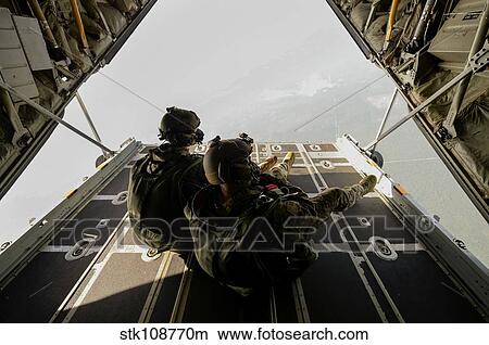 U. S. Army Green Berets wait to jump out of a C-130H3 Hercules. View Large Photo Image Picture - U. S. Army Green Berets wait to jump out of a C-130H3 Hercules.. Fotosearch