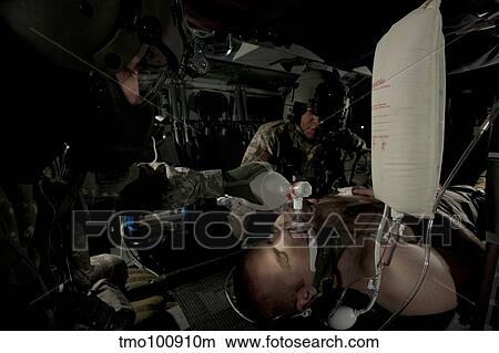 U. S. Army medics simulating ventilation of a mock patient aboard a UH-60 Blackhawk. View Large Photo Image Picture - U. S. Army medics simulating ventilation of a mock patient aboard a UH-60 Blackhawk.. Fotosearch