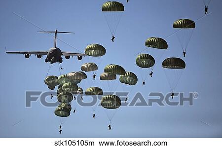 U. S. Army paratroopers jumping out of a C-17 Globemaster III aircraft. View Large Photo Image Picture - U. S. Army paratroopers jumping out of a C-17 Globemaster III aircraft.. Fotosearch