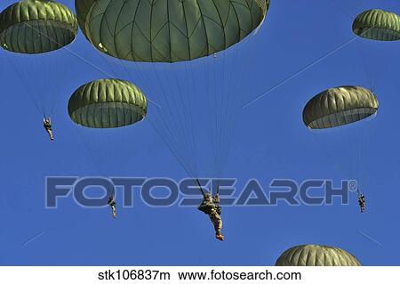 U. S. Army paratroopers participate in a personnel drop. View Large Photo Image Picture - U. S. Army paratroopers participate in a personnel drop.. Fotosearch