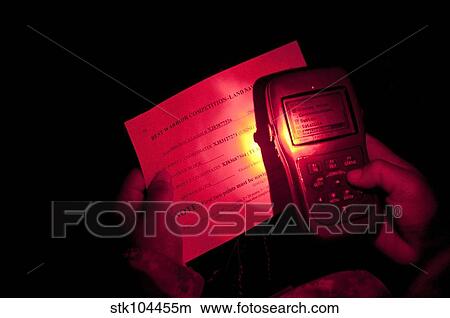 Picture - U. S. Army Sergeant checks her global positioning system.. Fotosearch