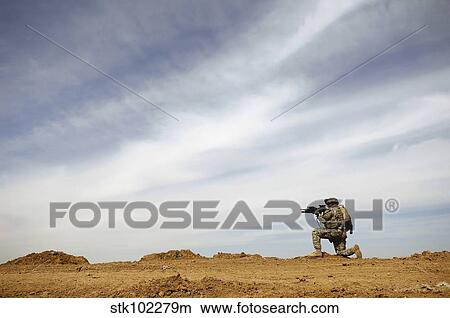 Picture - U. S. Army Sergeant provides security during a patrol in Iraq.. Fotosearch