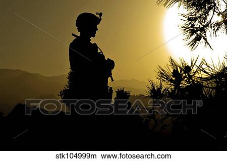 Picture - U. S. Army Sergeant provides security atop a mountain in Afghanistan.. Fotosearch