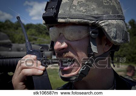 U. S. Army Sergeant testing his transmitter radio. View Large Photo Image Picture - U. S. Army Sergeant testing his transmitter radio.. Fotosearch