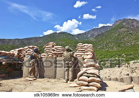 U. S. Army soldier and an Afghan security guard provide security. View Large Photo Image Picture - U. S. Army soldier and an Afghan security guard provide security.. Fotosearch