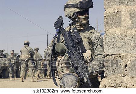 Picture - U. S. Army Soldier armed with a MK-48 light machine gun.. Fotosearch