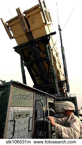 U. S. Army soldier checking a MIM-104 Patriot Missile System. View Large Photo Image Picture - U. S. Army soldier checking a MIM-104 Patriot Missile System.. Fotosearch