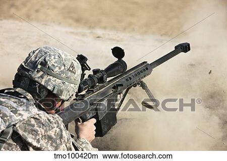 U. S. Army soldier fires a Barrett M82A1 rifle on a firing range View Large Photo Image Picture - U. S. Army soldier fires a Barrett M82A1 rifle on a firing range. Fotosearch