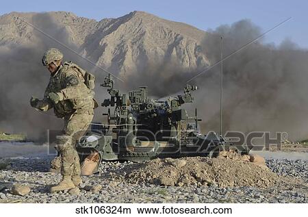 U. S. Army soldier fires an M777 howitzer. View Large Photo Image Picture - U. S. Army soldier fires an M777 howitzer.. Fotosearch