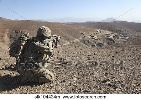 U. S. Army soldier provides security for infantry patrolling through Dandarh village, Afghanistan. View Large Photo Image Picture - U. S. Army soldier provides security for infantry patrolling through Dandarh village, Afghanistan.. Fotosearch