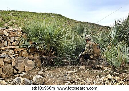 U. S. Army soldier provides security during a patrol in Afghanistan. View Large Photo Image Picture - U. S. Army soldier provides security during a patrol in Afghanistan.. Fotosearch