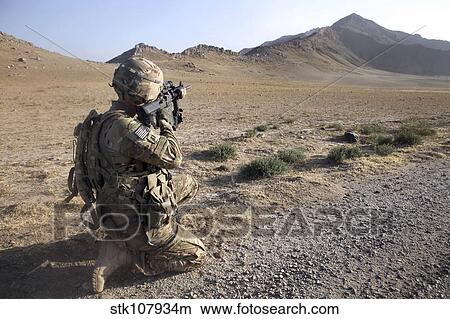 Picture - U. S. Army soldier pulls security in Afghanistan.. Fotosearch